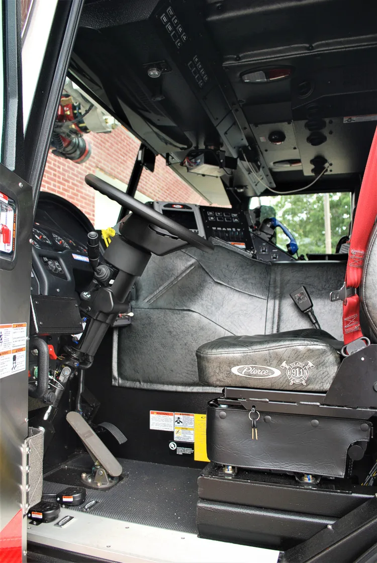 Cab interior side view showing rear seat area and side console
