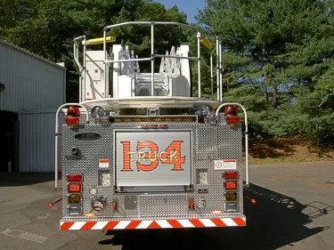 Rear view showing rear platform panel and lower warning striping