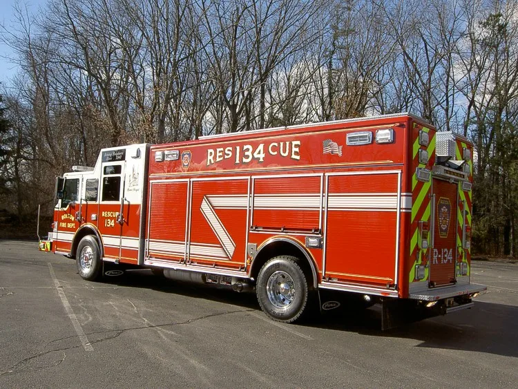 Rear-right exterior view showing long body and rear wheel area