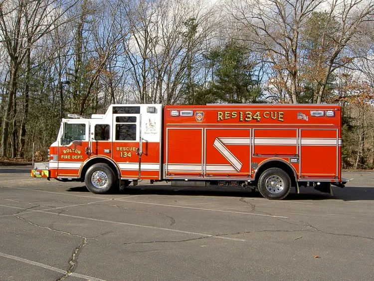 Passenger-side profile view showing long side compartments and wheel area