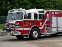 Pumper front-left exterior profile showing cab and side body