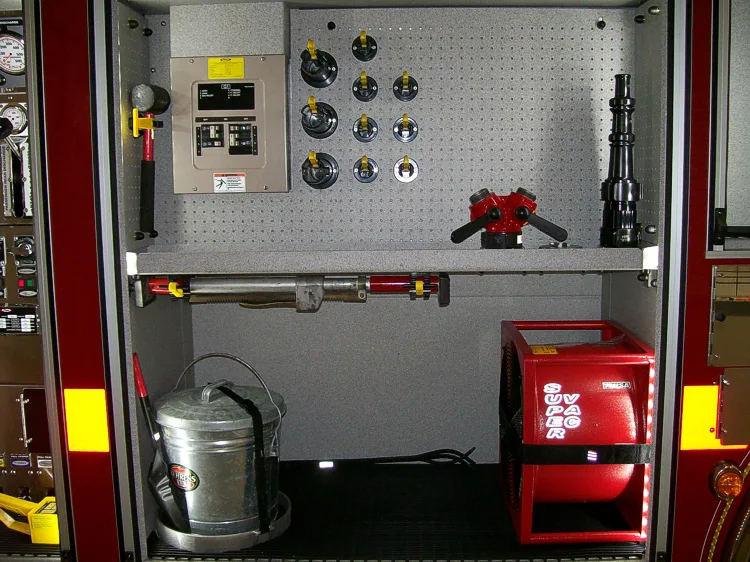 Open side compartment showing pump controls and lower storage bay
