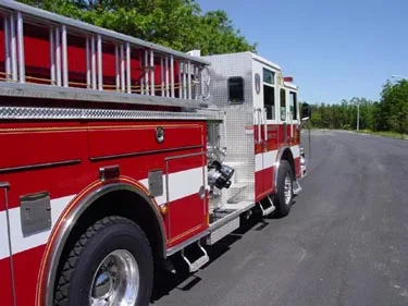 Driver-side detail view showing ladder rack and side body panel