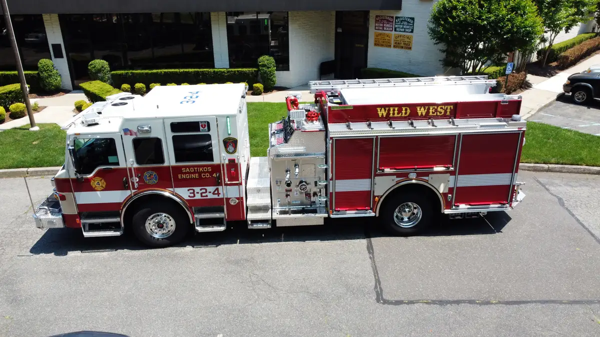 Pierce pumper aerial driver-side profile showing pump panel area and side compartments