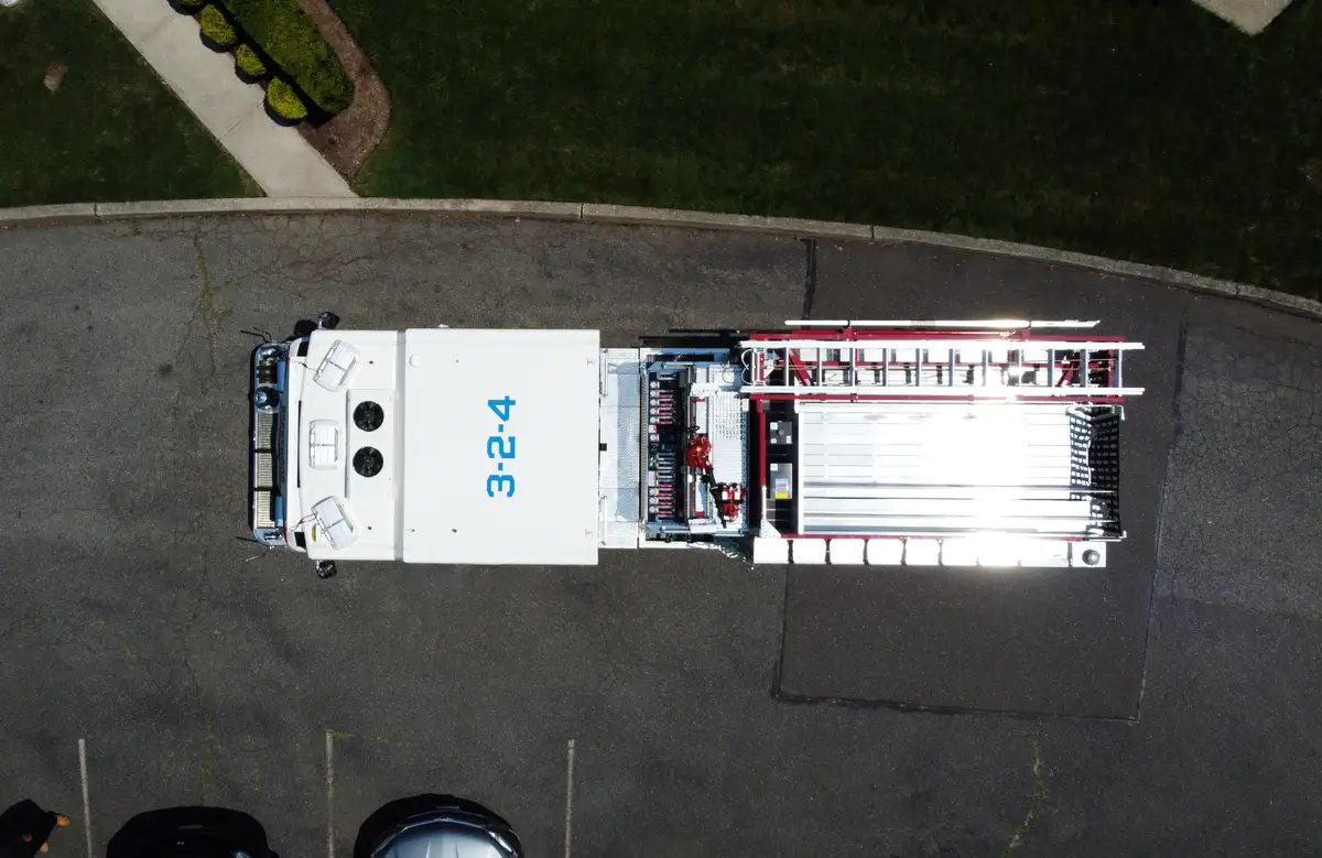 Pierce pumper top-down aerial view showing cab roof and hosebed layout
