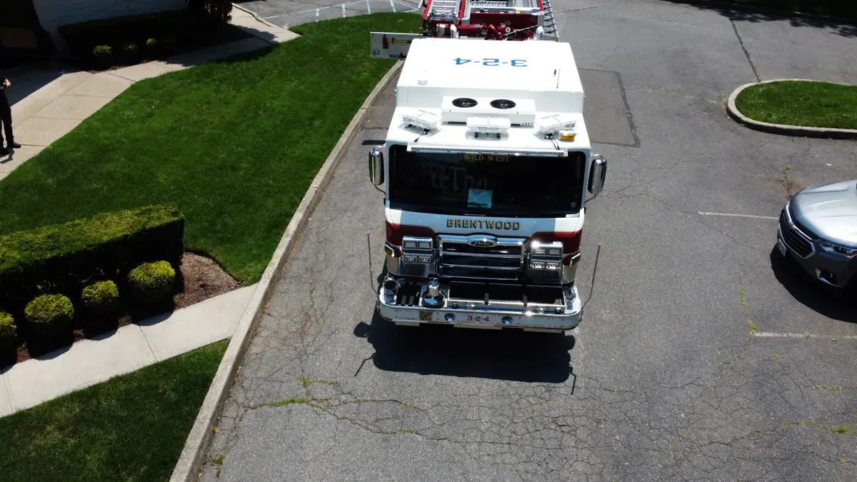 Pierce pumper aerial front view showing grille, bumper, and warning lights