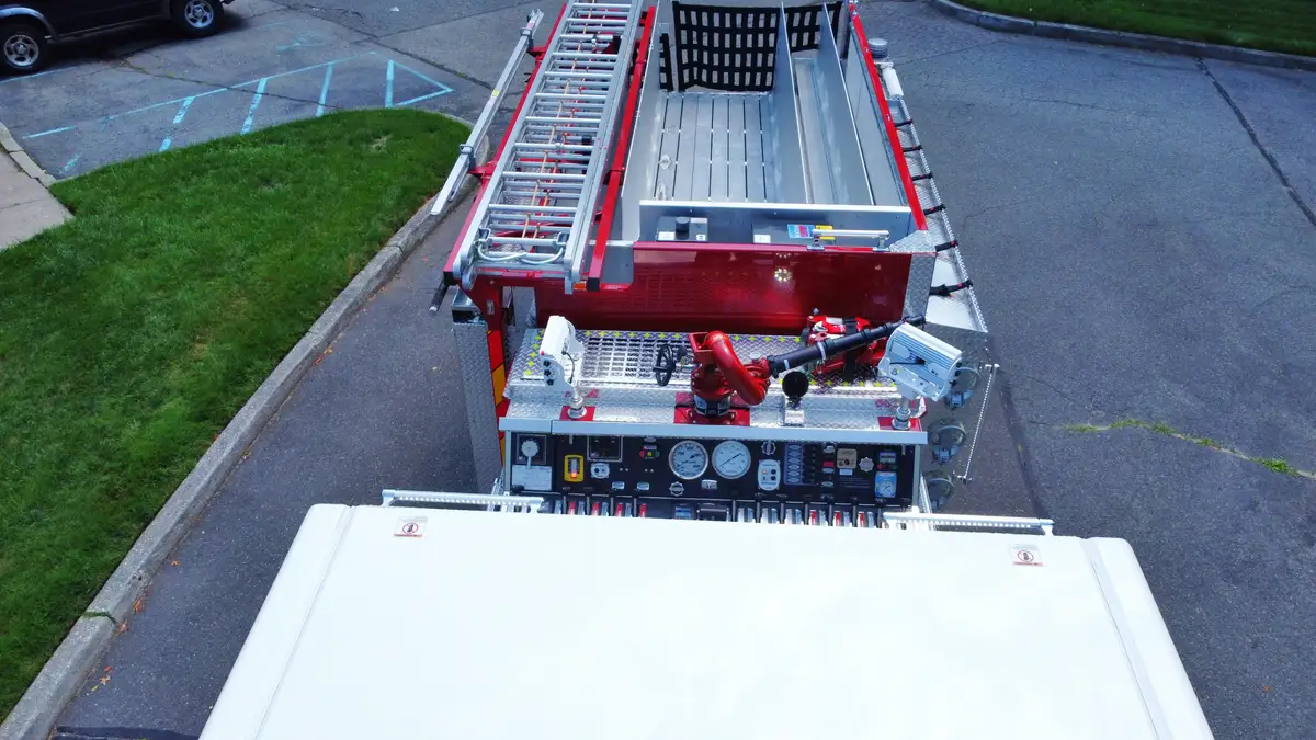 Top-mount pump panel full view showing gauges, intake valves, and discharge controls