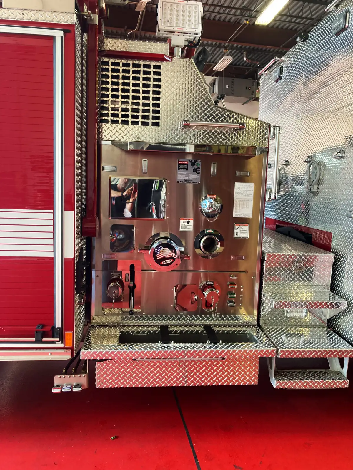 Front bumper deck gun close-up showing polished waterway fitting and mounting base