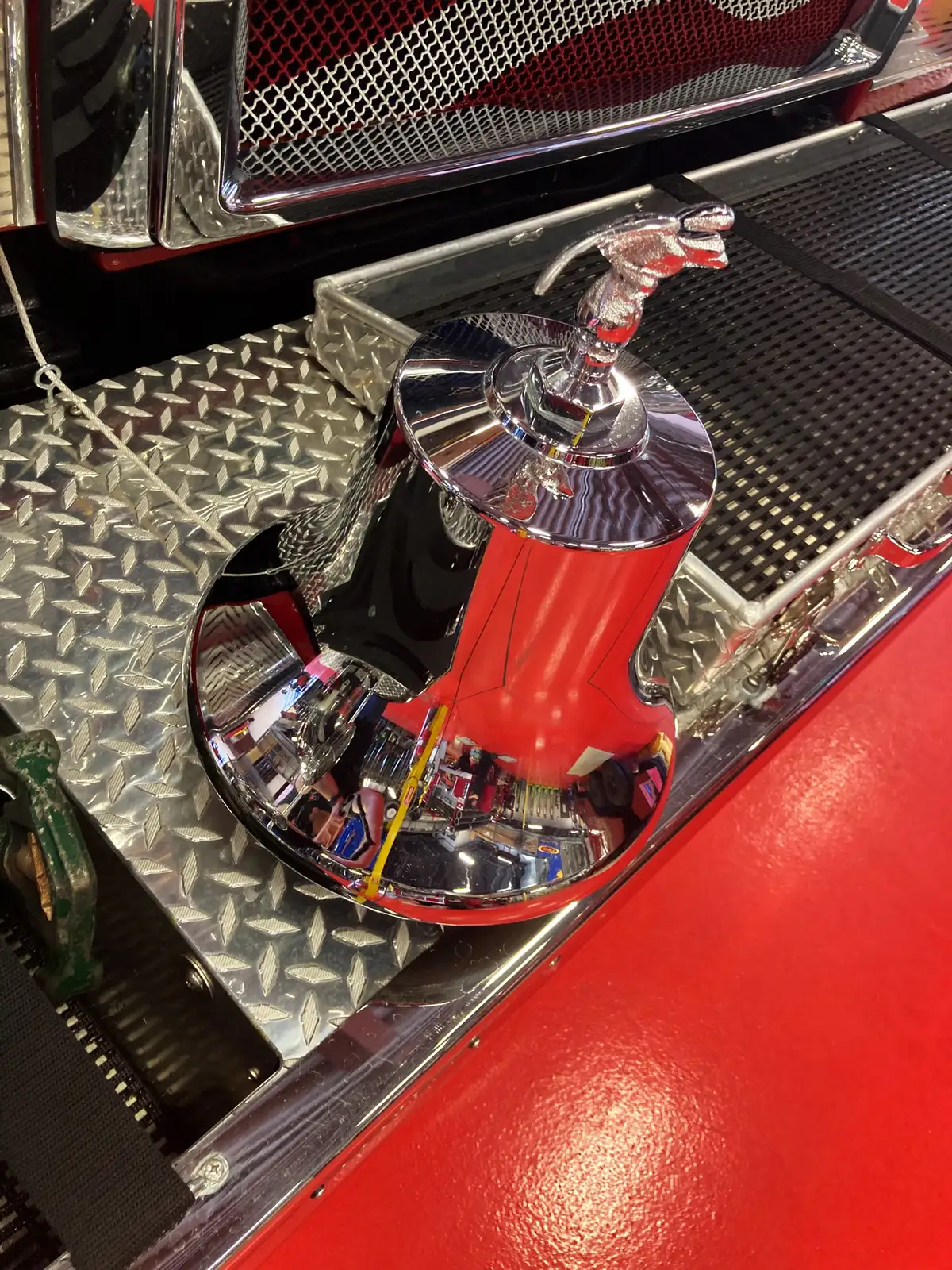 Pierce pumper front-left view inside bay showing grille and bumper