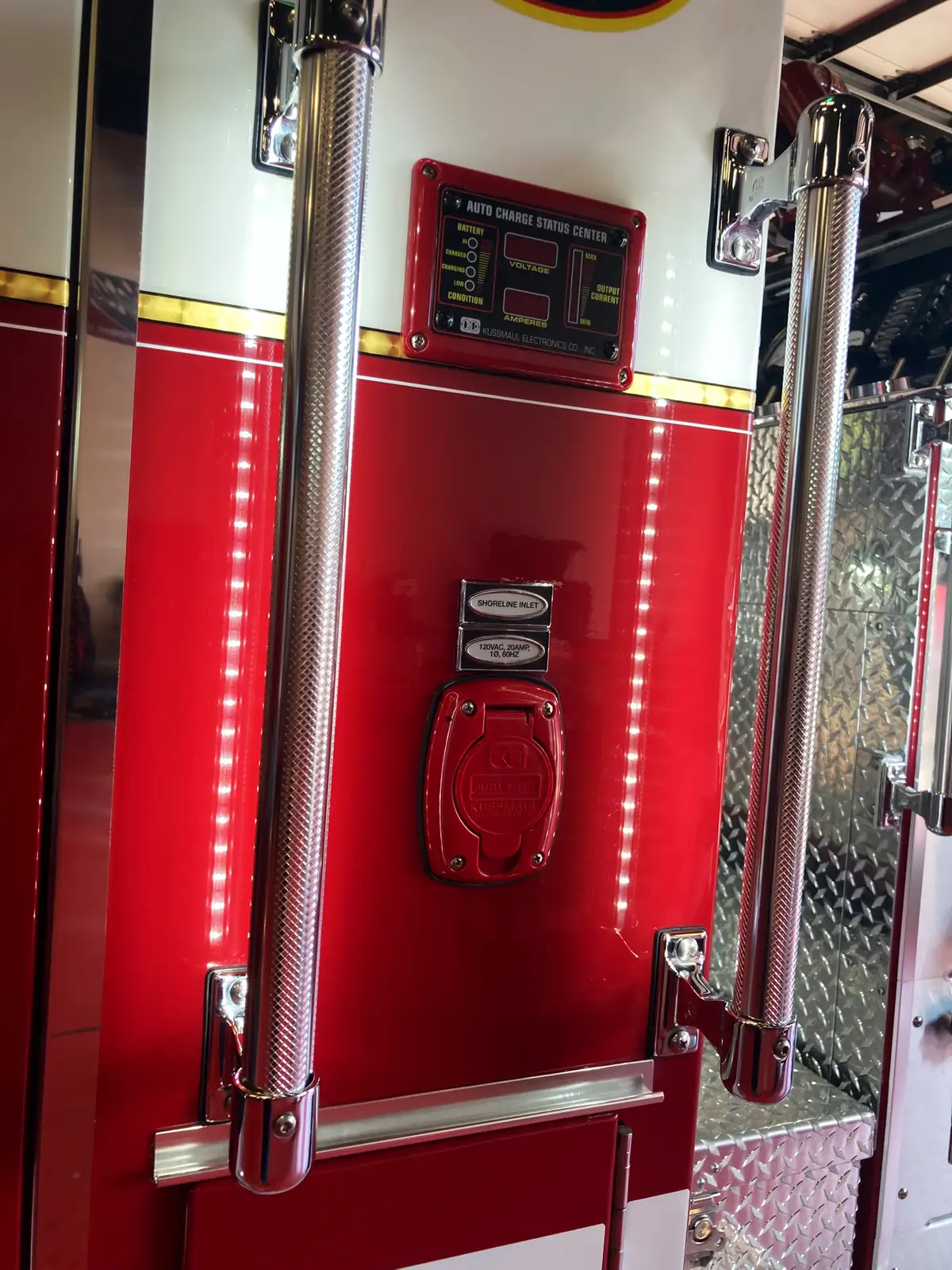 Cab exterior close-up showing fire department crest decal and vertical warning light