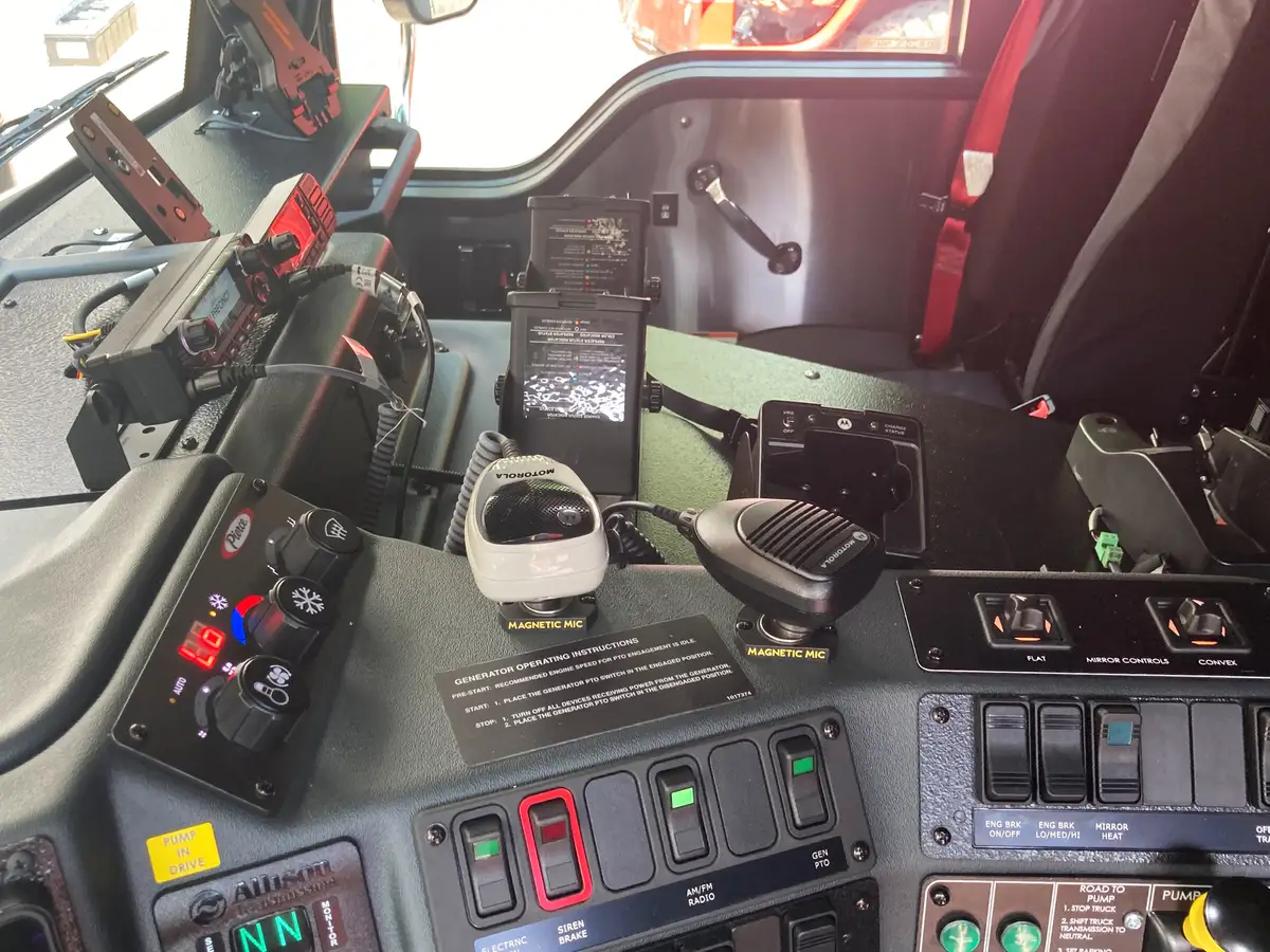 Overhead switch panel close-up with labeled rocker switches and cab lighting controls
