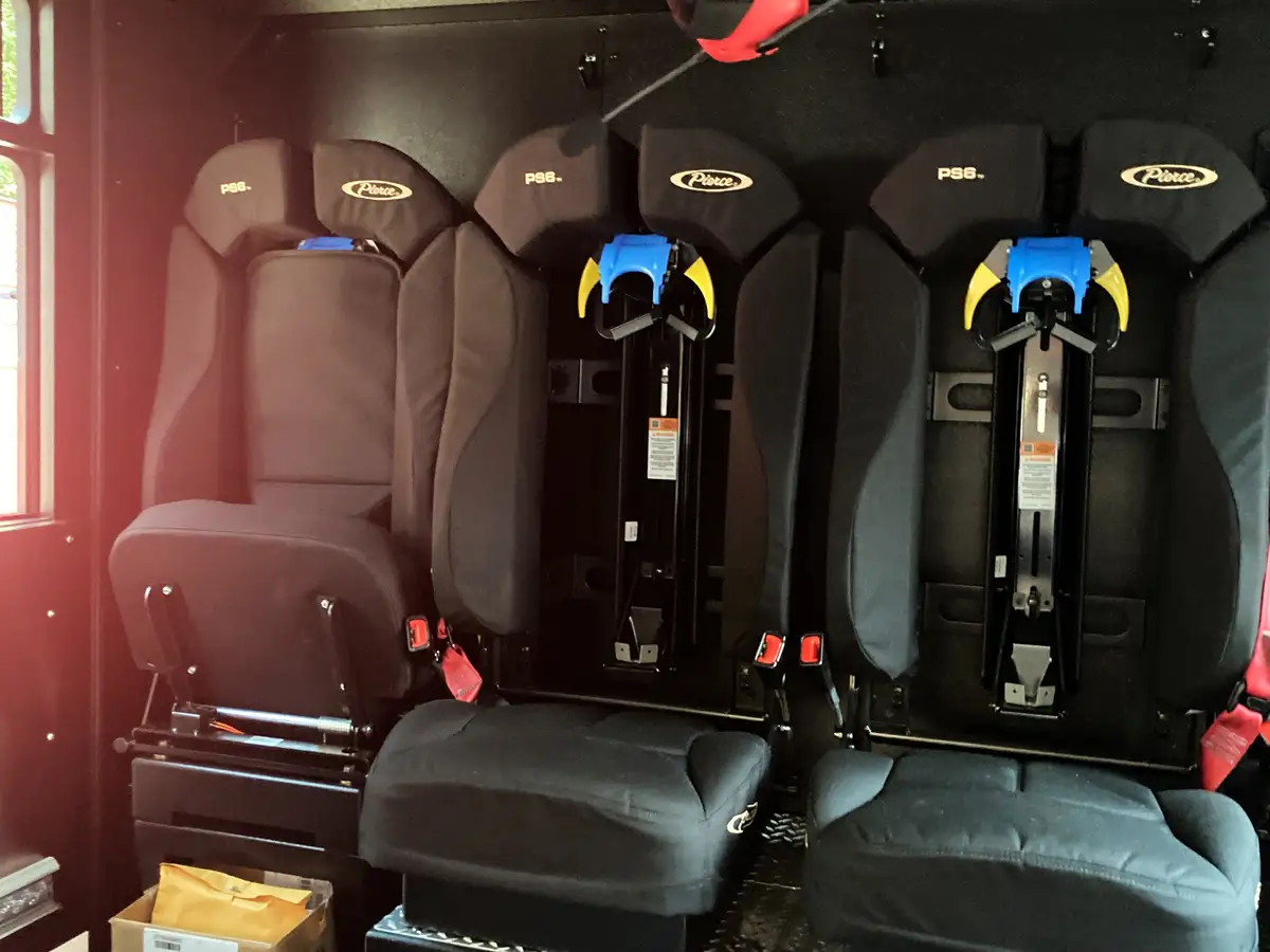 Rear crew seating area showing SCBA seat mounts and side bench
