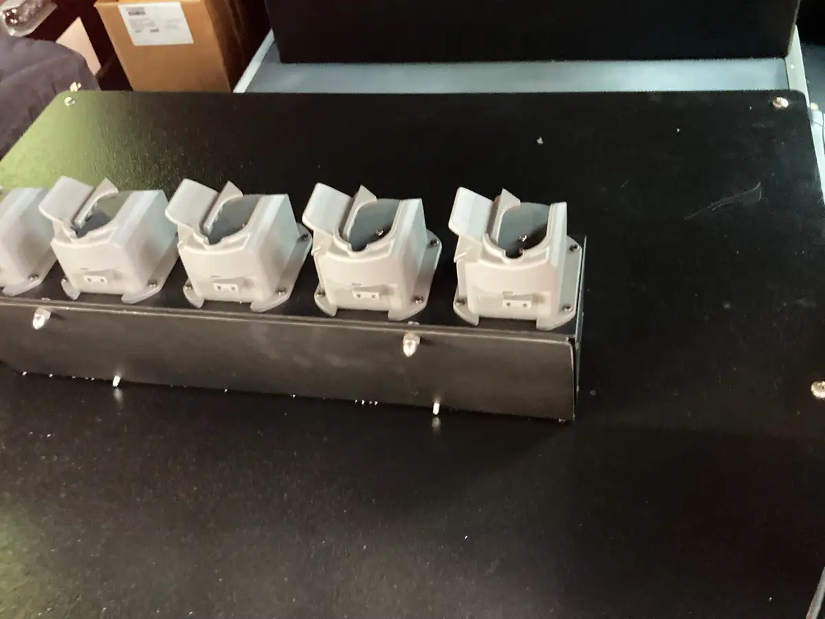 Driver console close-up showing communication controls and switch bank