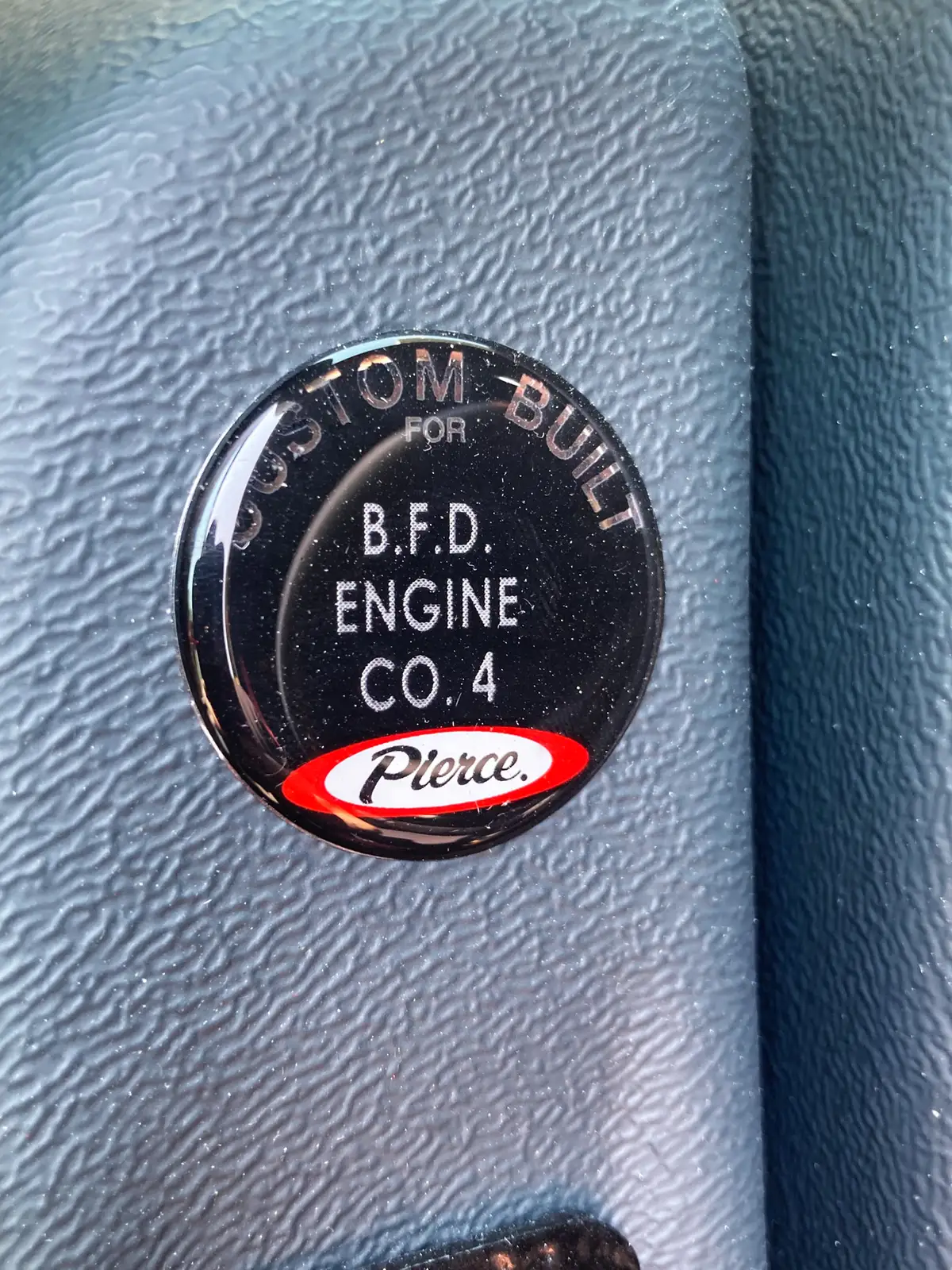 Rear cab work surface with charging cradle dock and cab controls in background