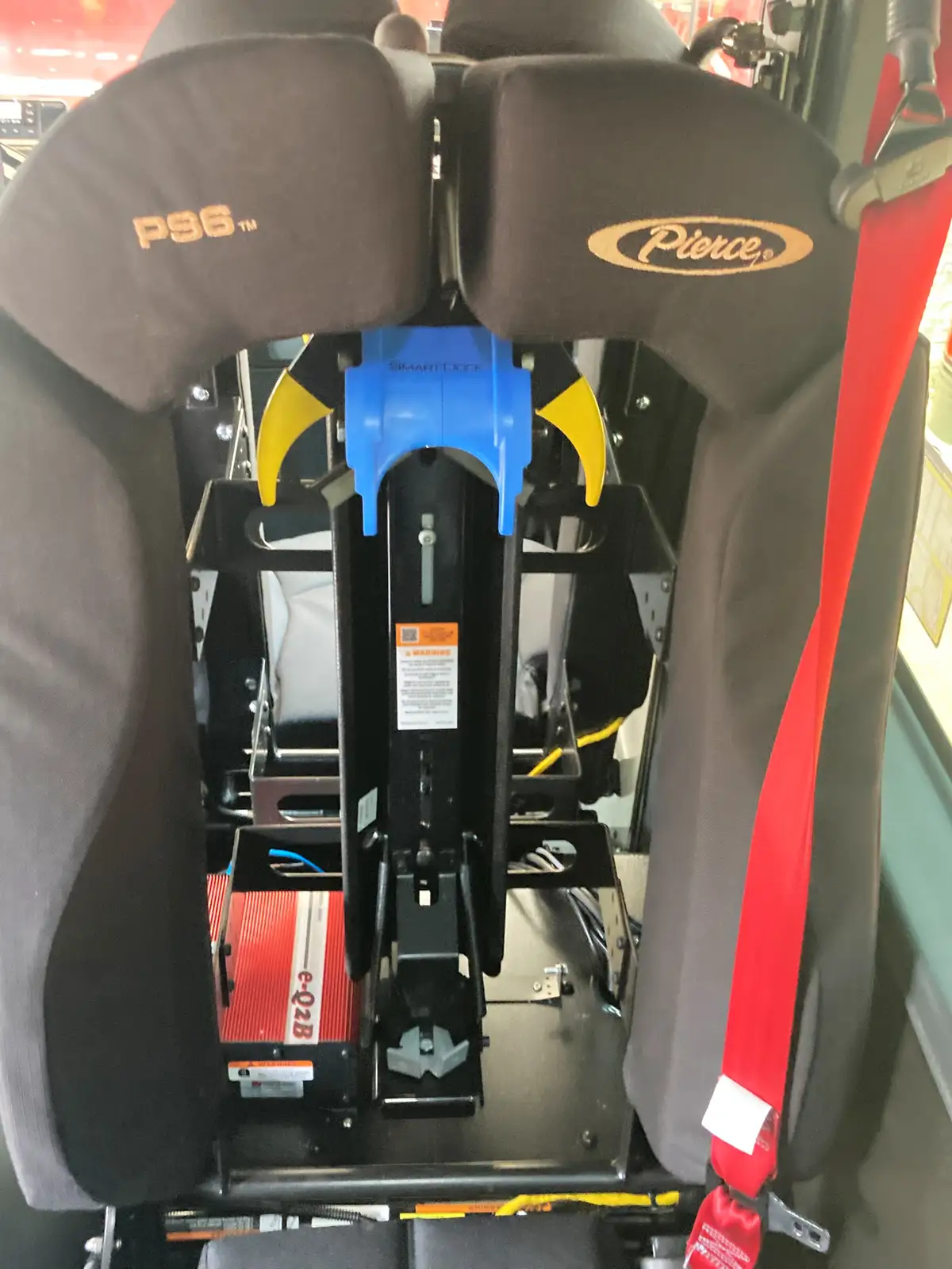 Rear crew SCBA mount close-up with seatbelt and bracket assembly