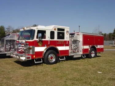 Single pumper front-right exterior view showing cab and side compartments