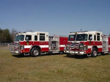 Two-pumper front-left lineup view showing cabs and front bumpers