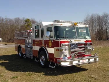 Single pumper front-left exterior view showing bumper, cab, and side compartments