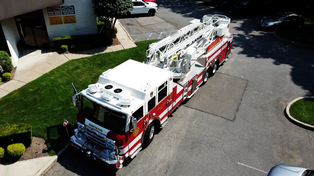 Cab roof close-up showing roof-mounted vents and warning lights