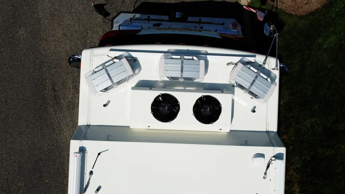 Cab roof detail close-up with circular fan housings and access hatches