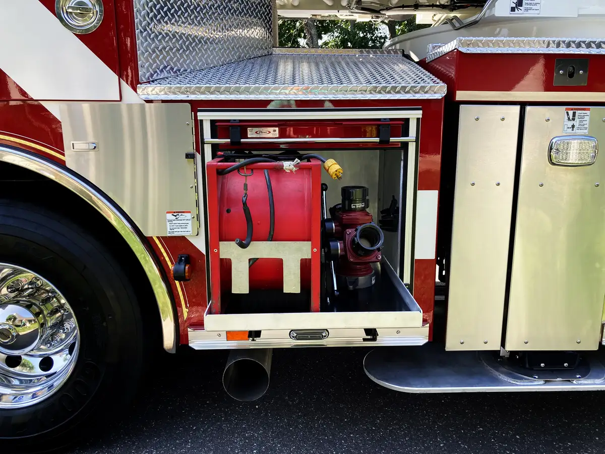 Narrow side compartment close-up showing hydraulic controls and valves