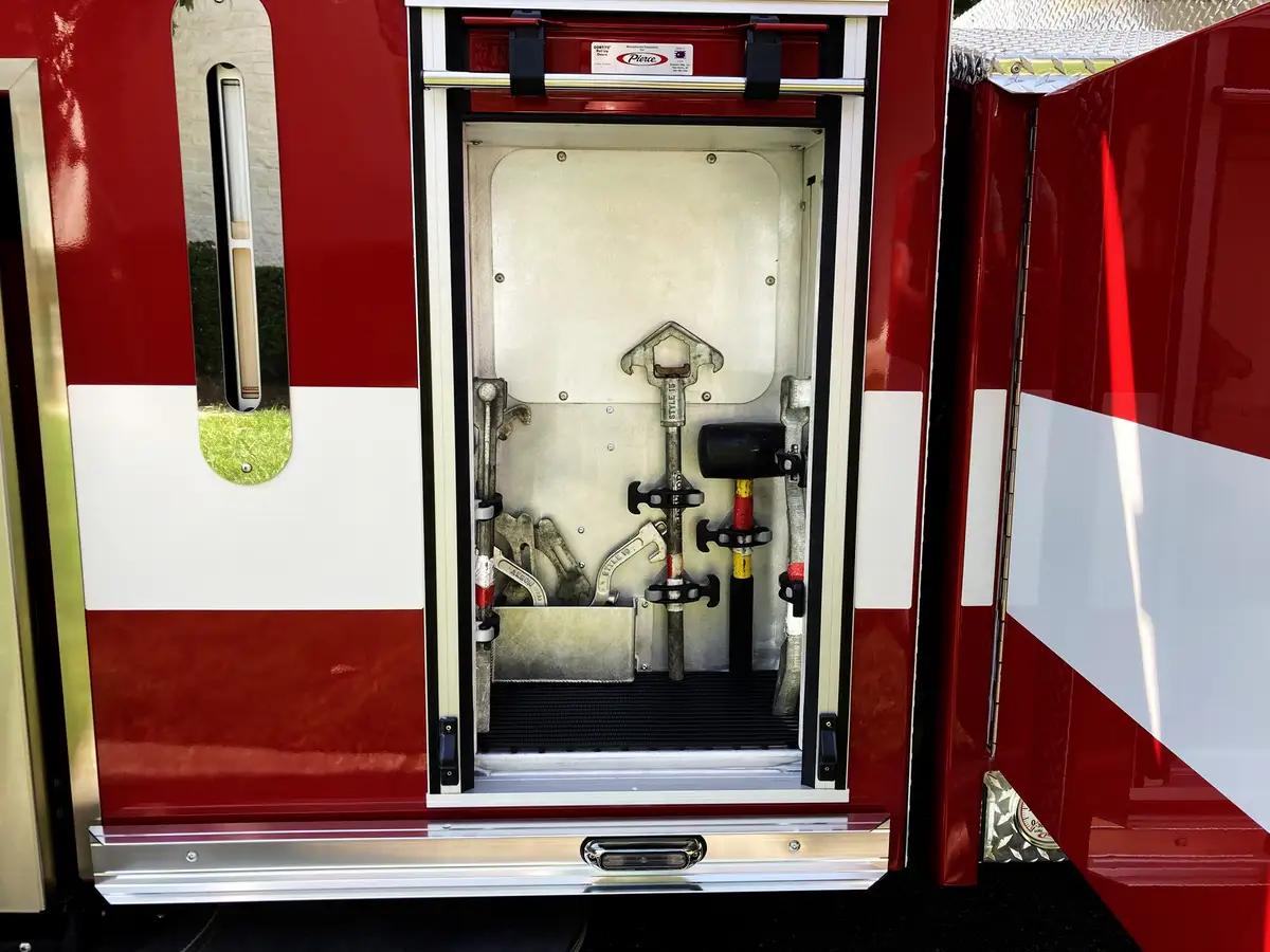 Open side compartments with slide-out rescue trays and stokes basket storage
