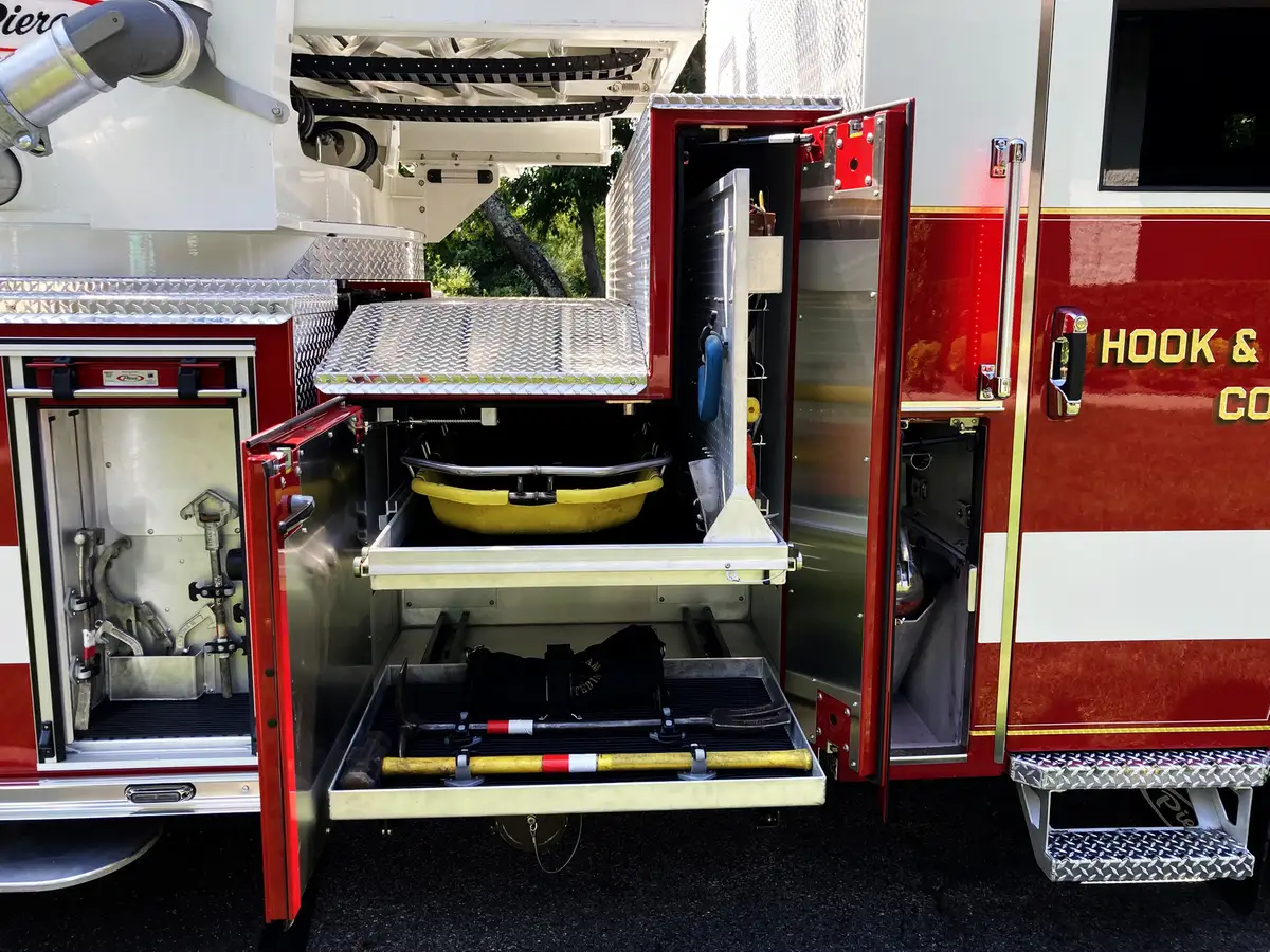 Officer-side wide view with multiple open compartments and slide-out platforms