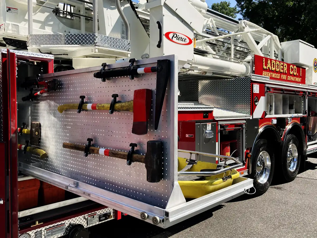 Officer-side compartment group open showing slide-out trays and equipment bins