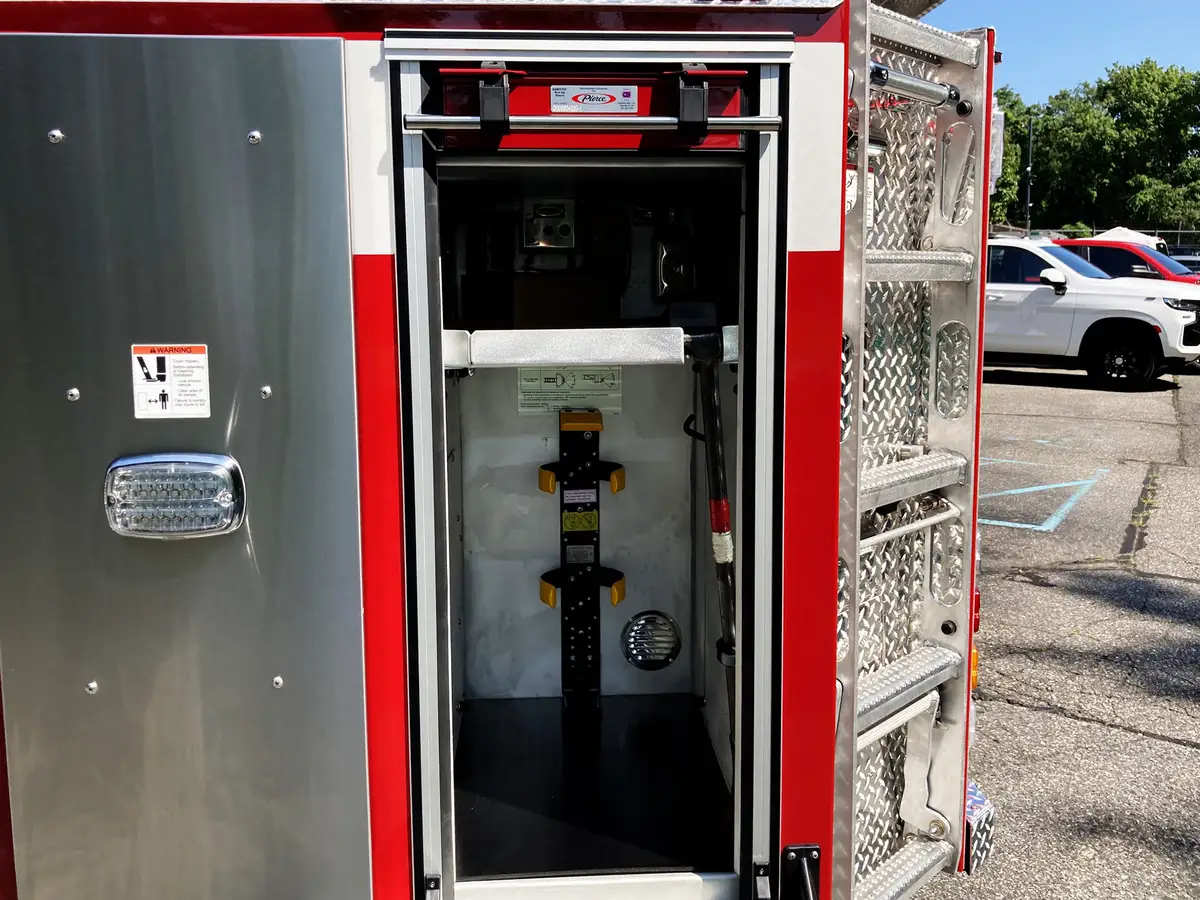 Aerial bucket exterior view showing truck identifier markings and side panel