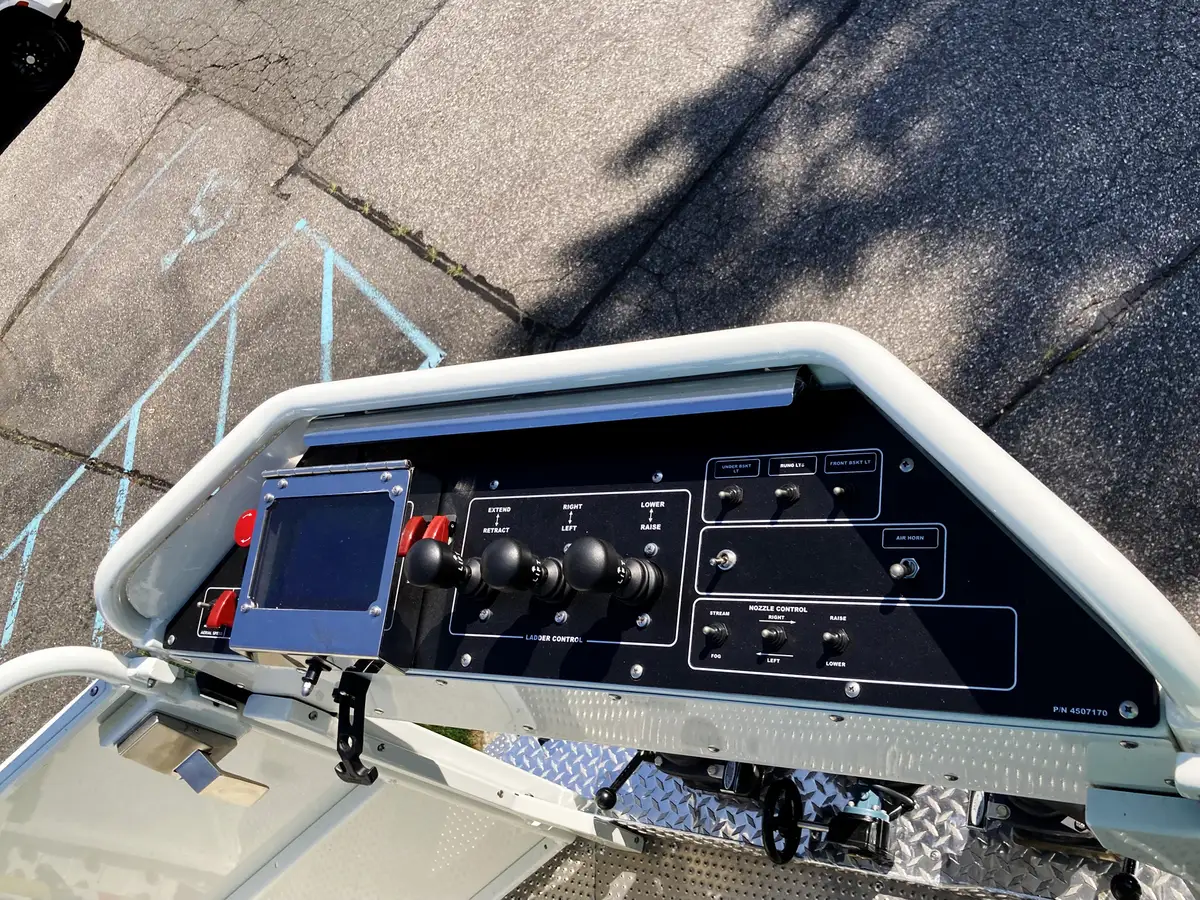 Rear stabilizer storage rack open with nested ground ladder support hardware