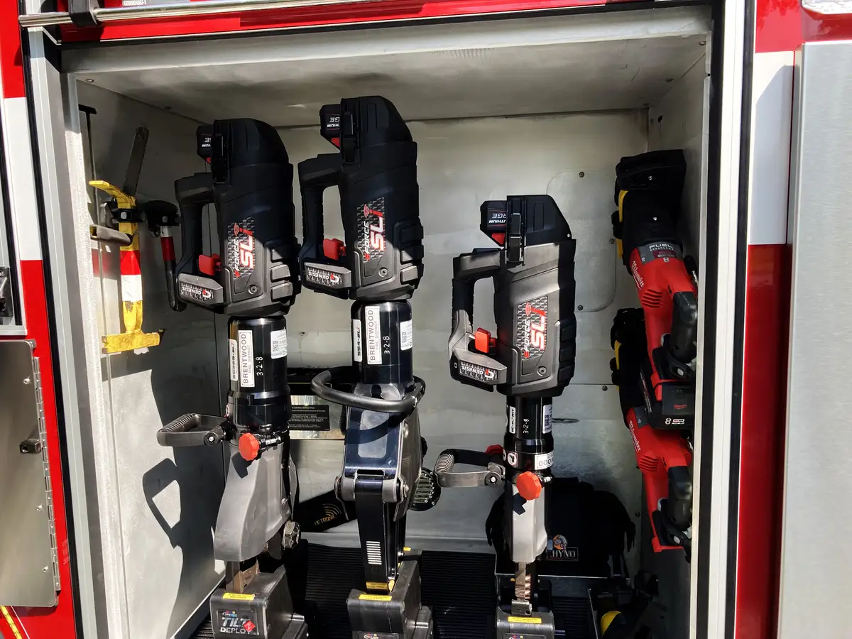 Side body lettering panel below aerial device with apparatus company text