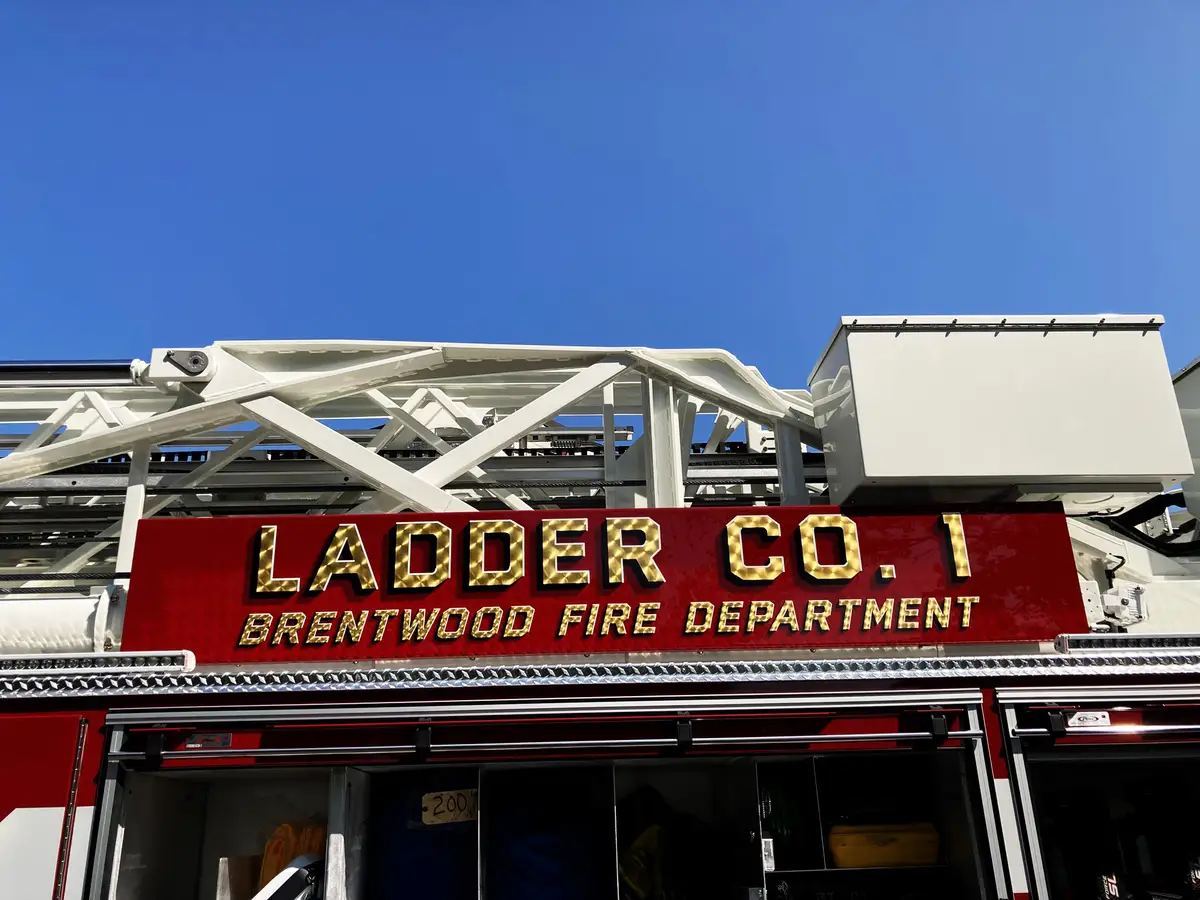 Pierce tower ladder low-angle front view showing bumper and grille
