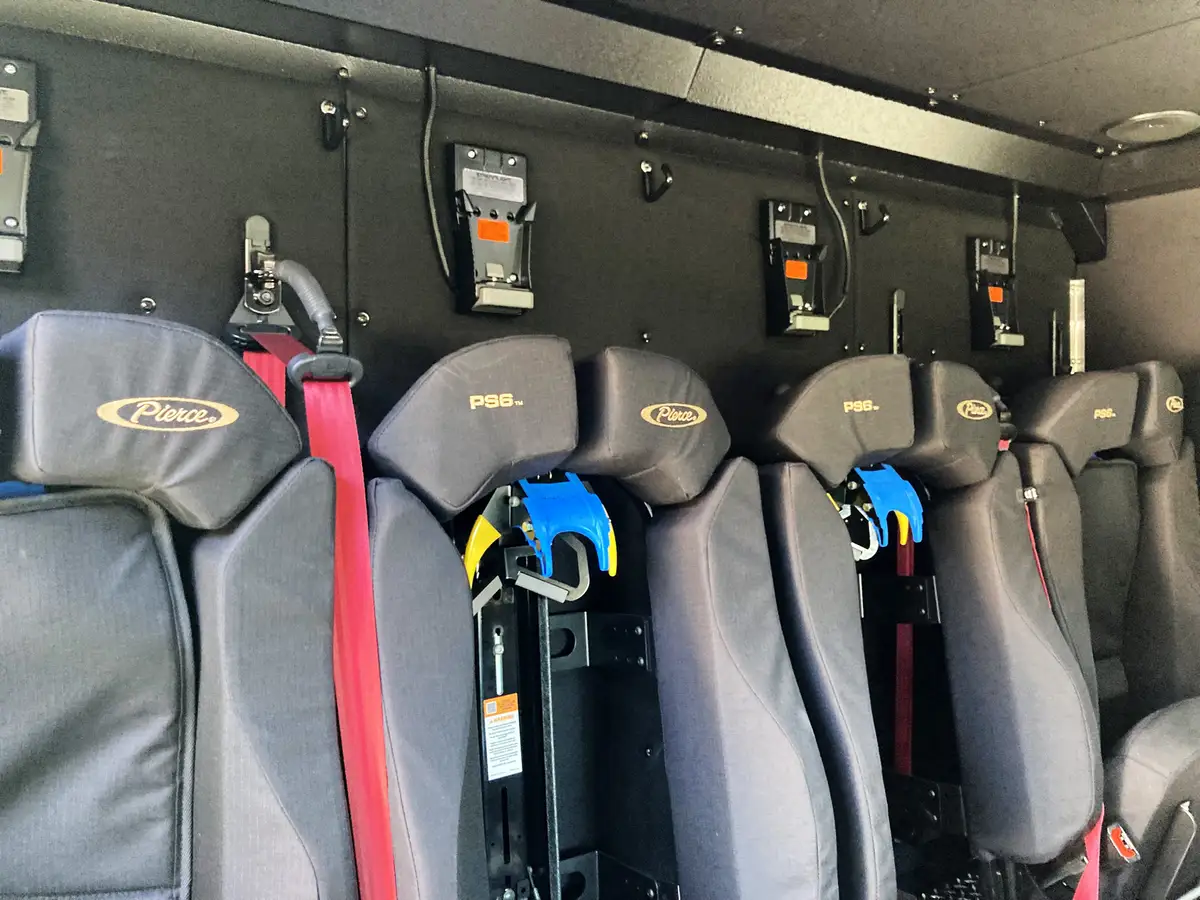 Open side compartment with battery rescue tools and protective hard case