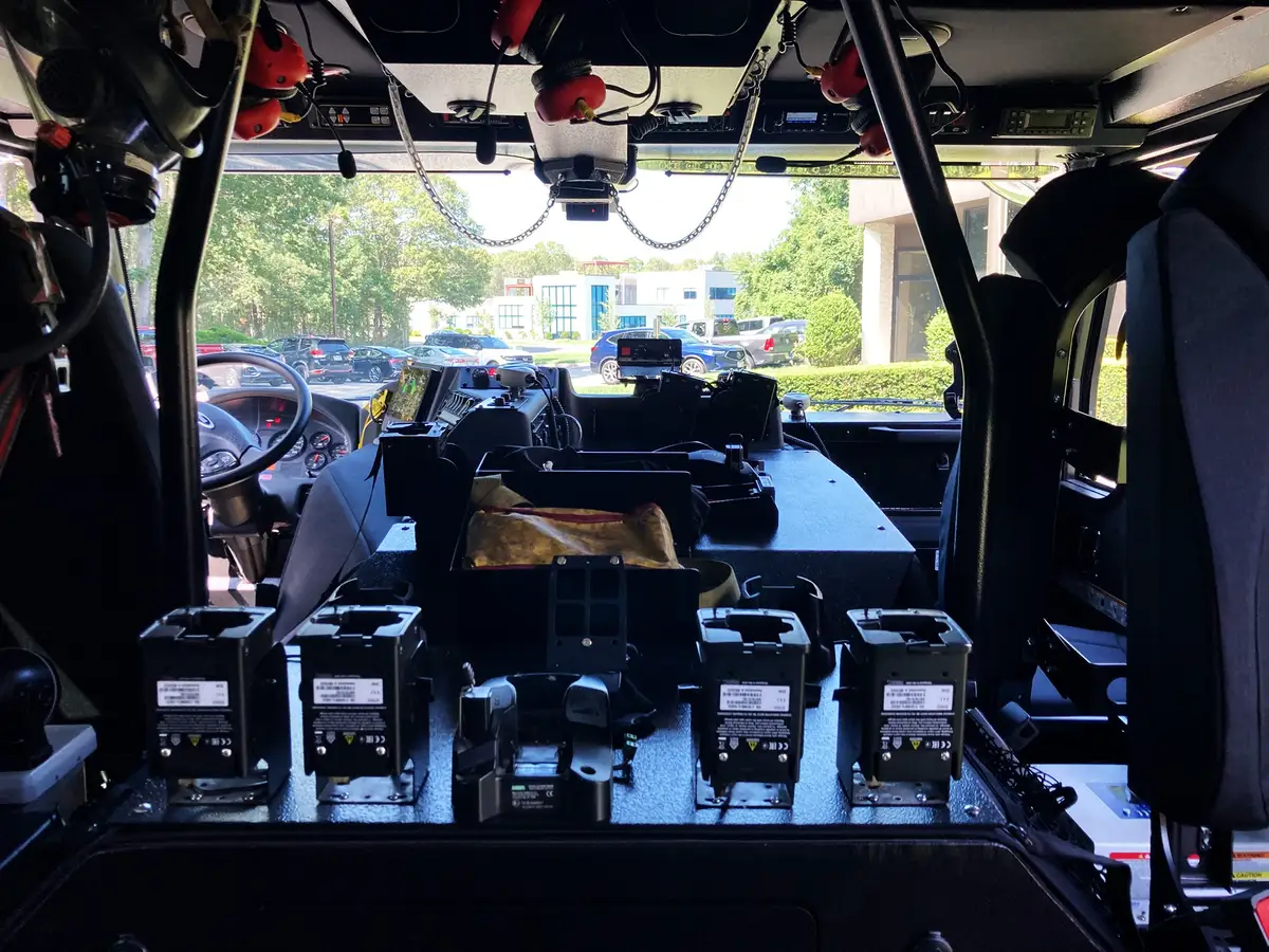 Pierce tower ladder front-left exterior view with sun flare and full cab profile