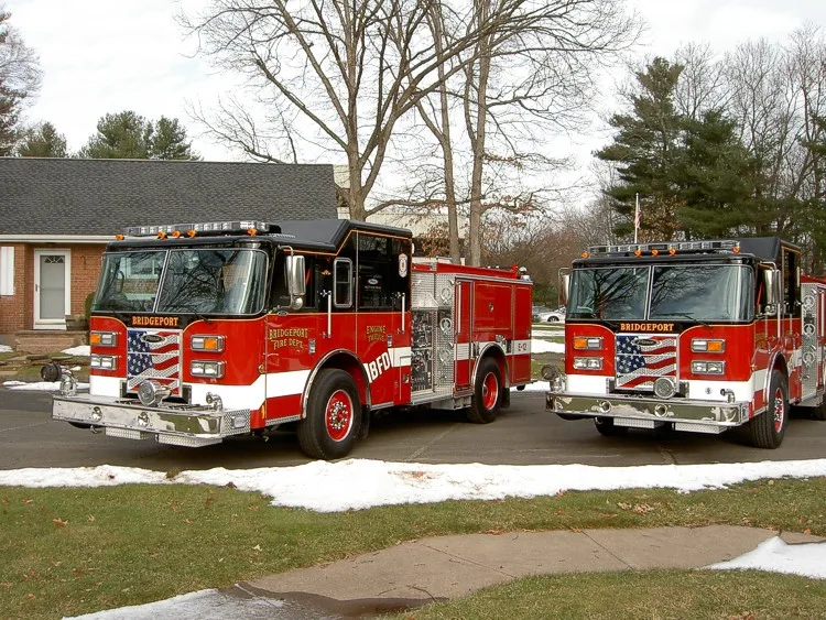 Two-apparatus front-quarter lineup view showing grilles and bumpers