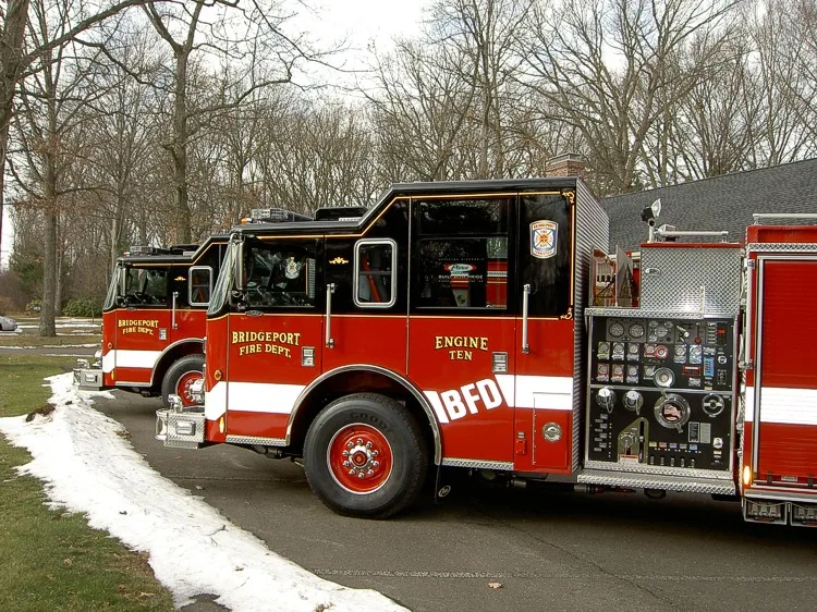 Driver-side profile with open pump panel showing gauges and controls