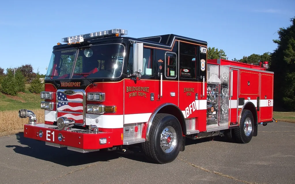 Front-left exterior view showing bumper, cab, and side compartments