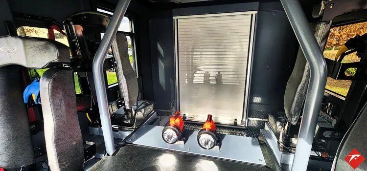 Rear crew area close-up showing seat mounts and side paneling