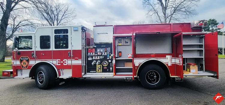 Driver-side profile showing pumper body and rear wheel area