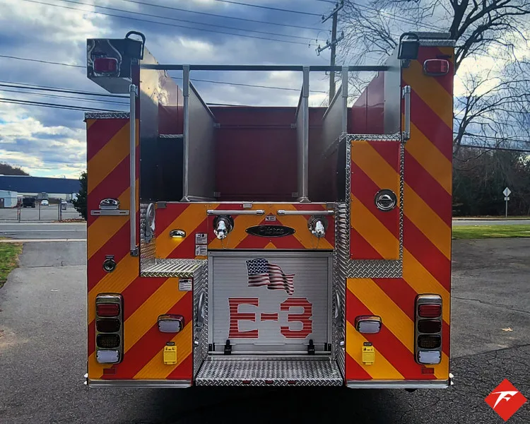 Rear view showing red-and-yellow chevrons and rear center panel