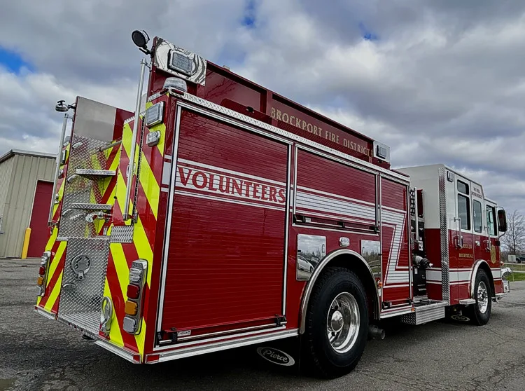 Rear-left exterior view showing side body panel and rear wheel area