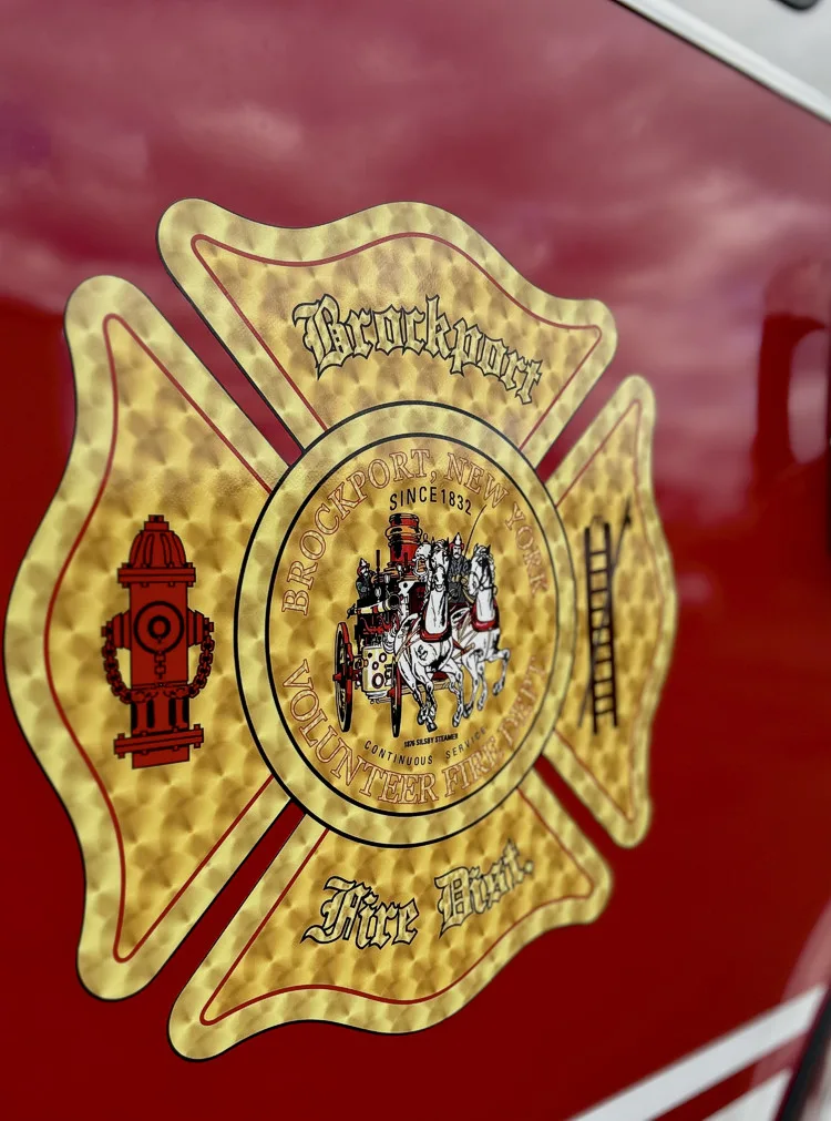 Cab door close-up showing department crest and reflective door striping