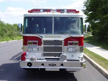 Front exterior view showing grille, bumper, and warning lights