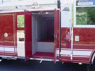 Rear crew cab entry view showing open door and interior step area