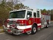 Pumper front-left exterior view showing enclosed cab and side compartments