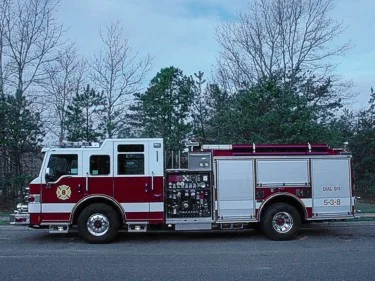 Driver-side profile showing exposed pump panel and side body compartments