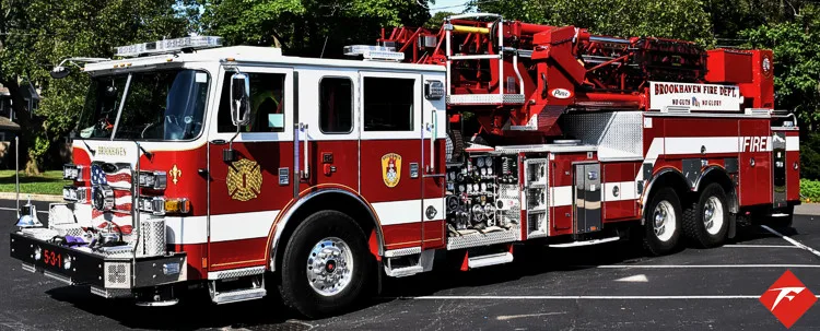 Tower ladder truck front-left profile showing full side body and ladder