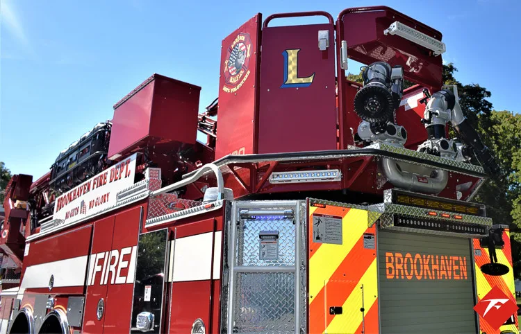 Ladder base close-up showing red upper platform and rear equipment