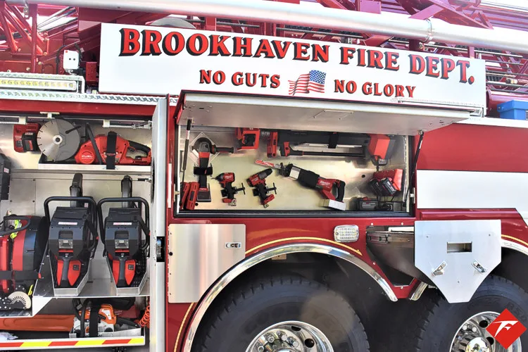 Open side compartment showing mounted rescue tools and equipment shelves