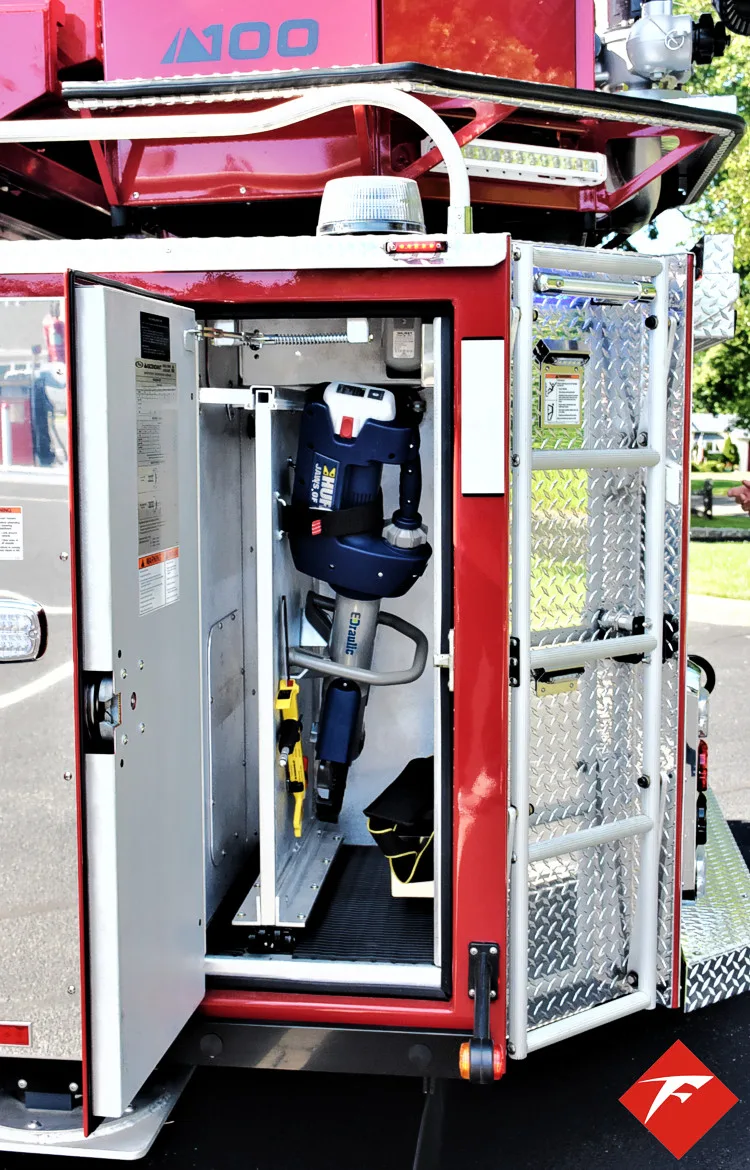 Open side compartment showing upright storage bay and tool rack